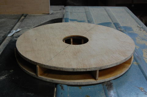 Air goes into the hole in the middle and whirls out at the edges. Vacuum impeller v1